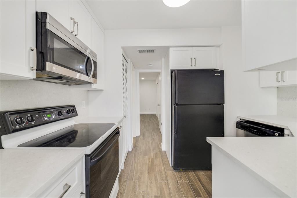The kitchen renovation in 2024 brought modern SHAKER STYLE CABINETRY with soft close features, QUARTZ COUNTERS that you will also find in the guest bath and a stylish backsplash complementing it all.