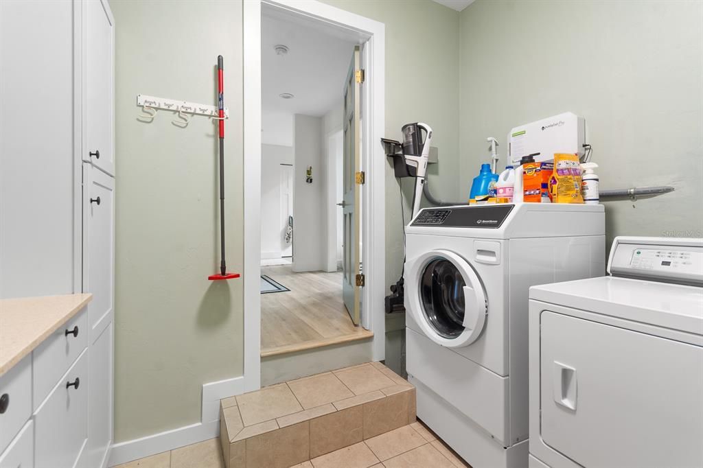 Indoor laundry area with lots of additional storage