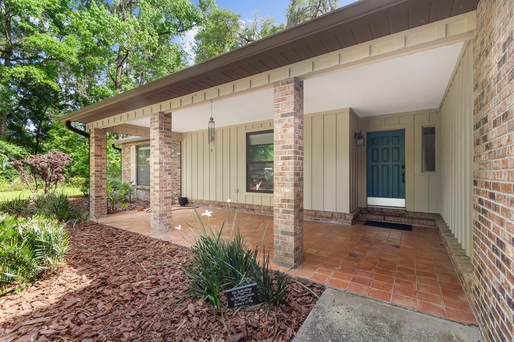 Covered and tiled front porch