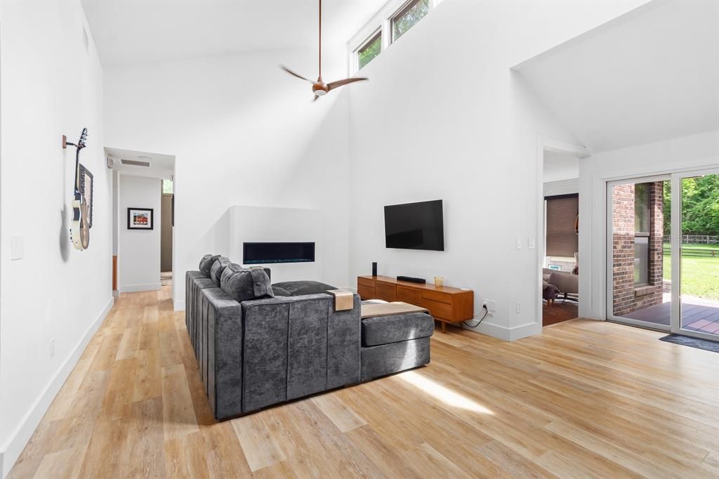 Great Room with vaulted ceiling, clerestory windows and gas fireplace