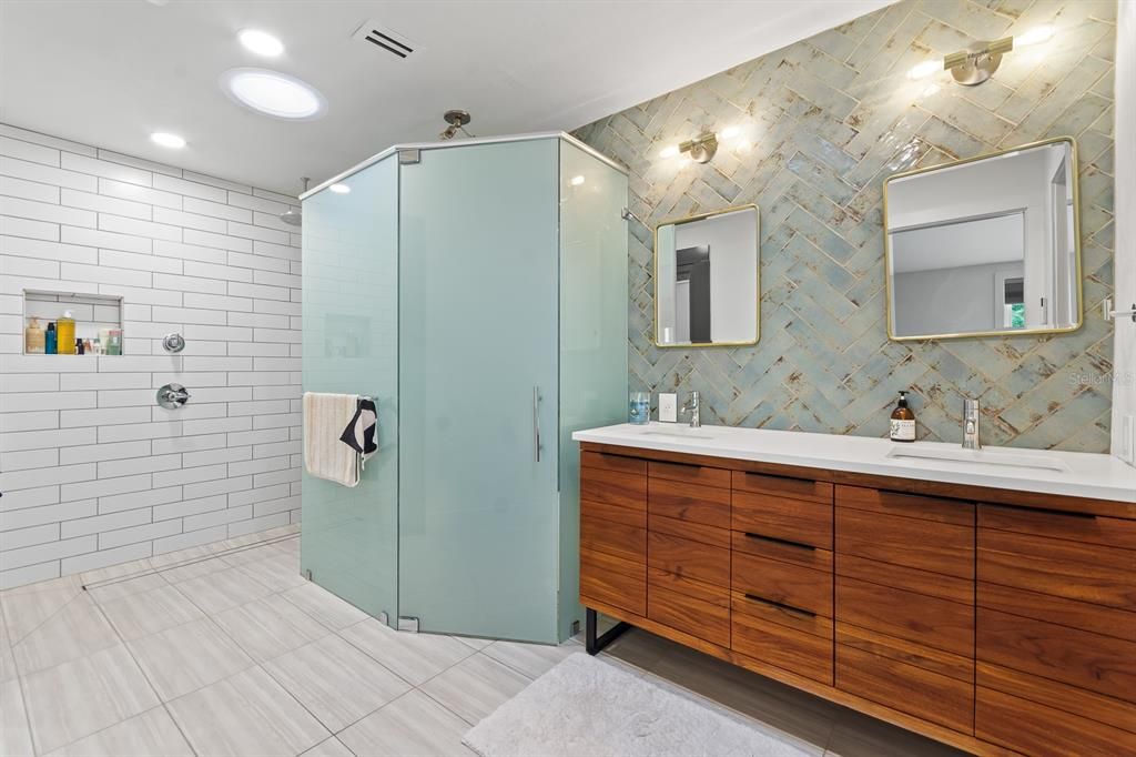 Remodeled and updated Primary Bathroom with walk-in shower, double sink vanity and enclosed water closet