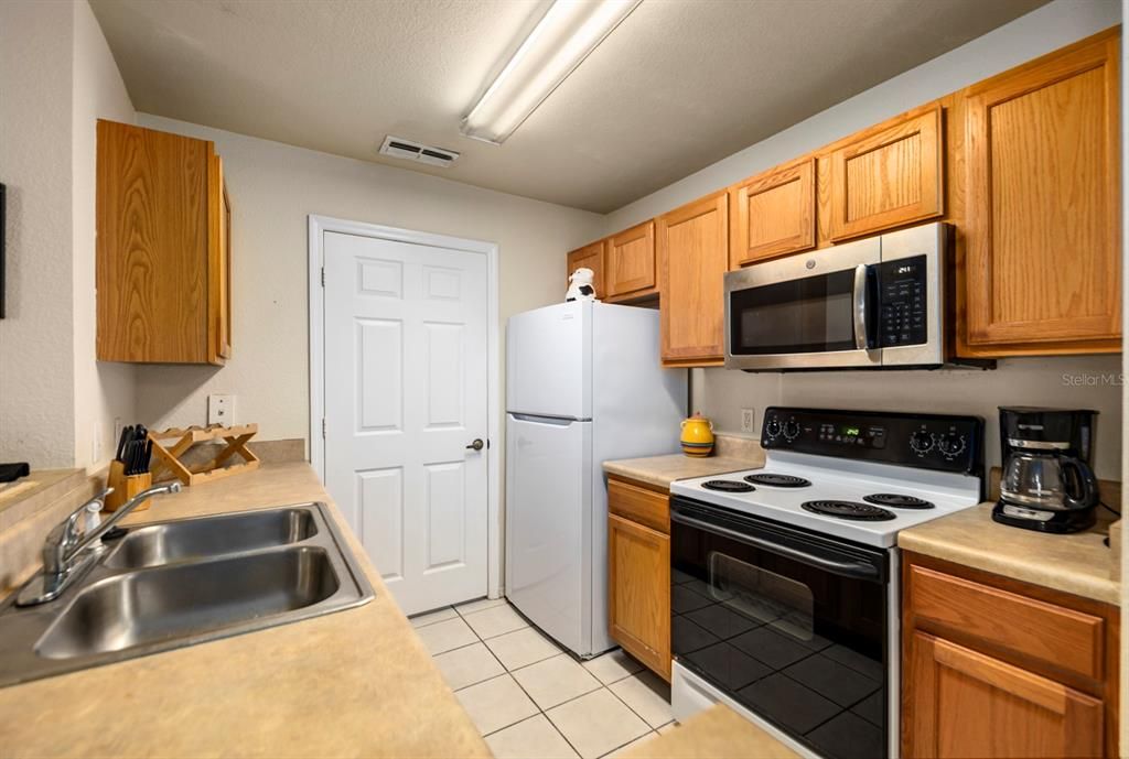 Well equipped kitchen with laundry room.