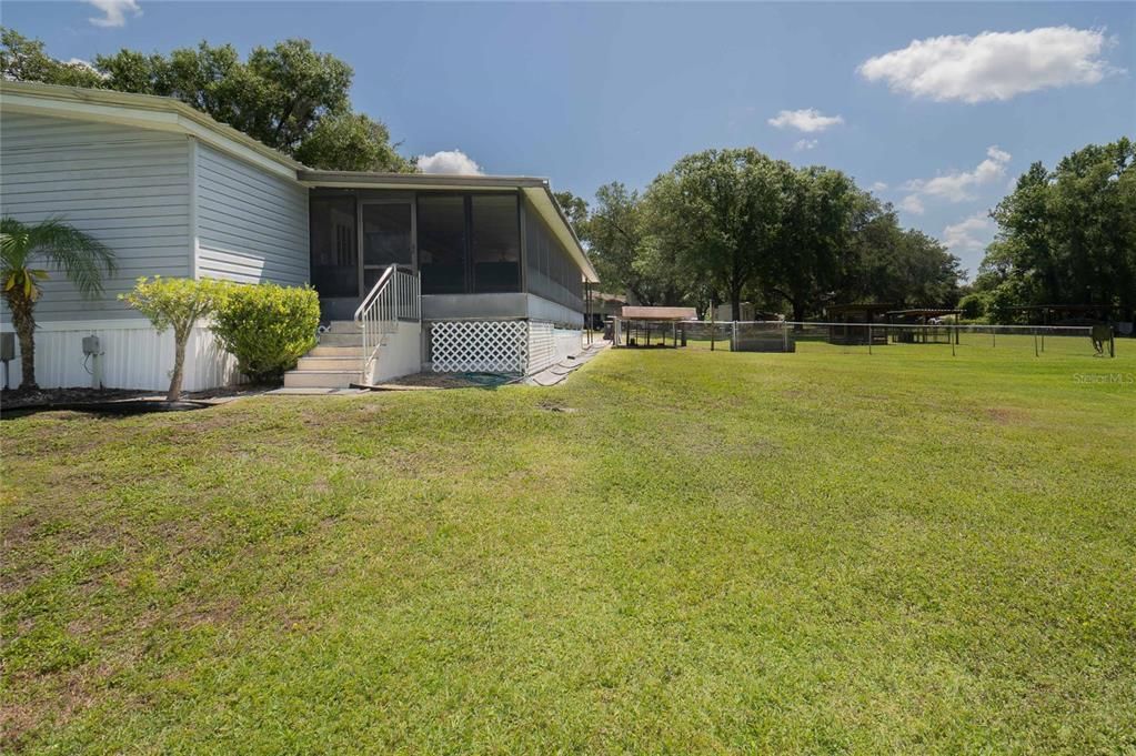 Side view with entry to the screened patio.