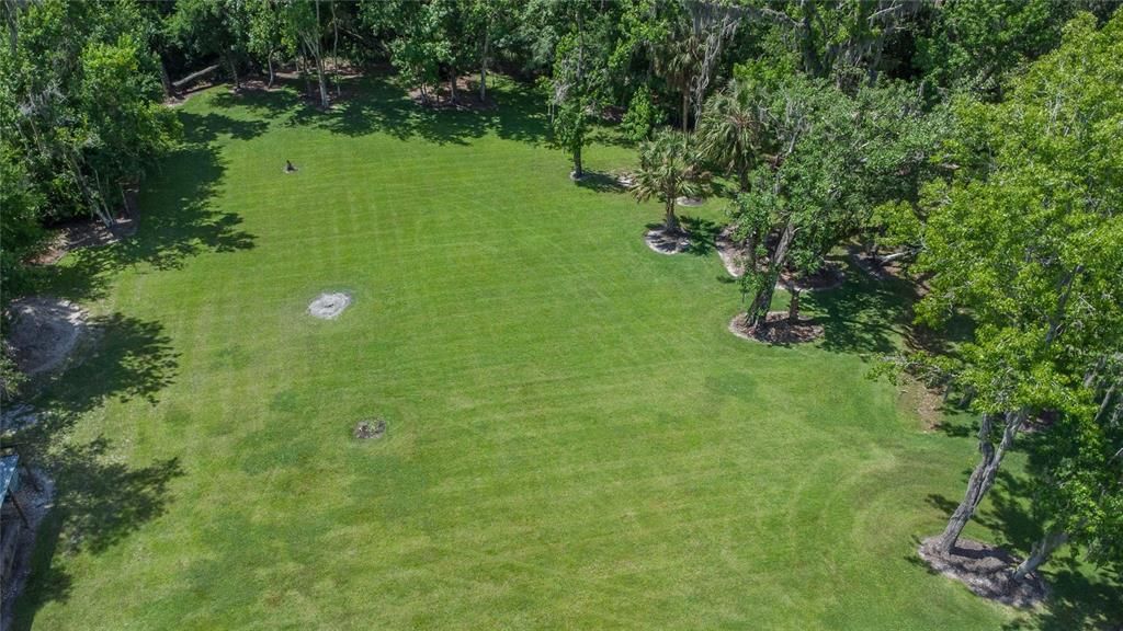 Backyard view with a park like setting.