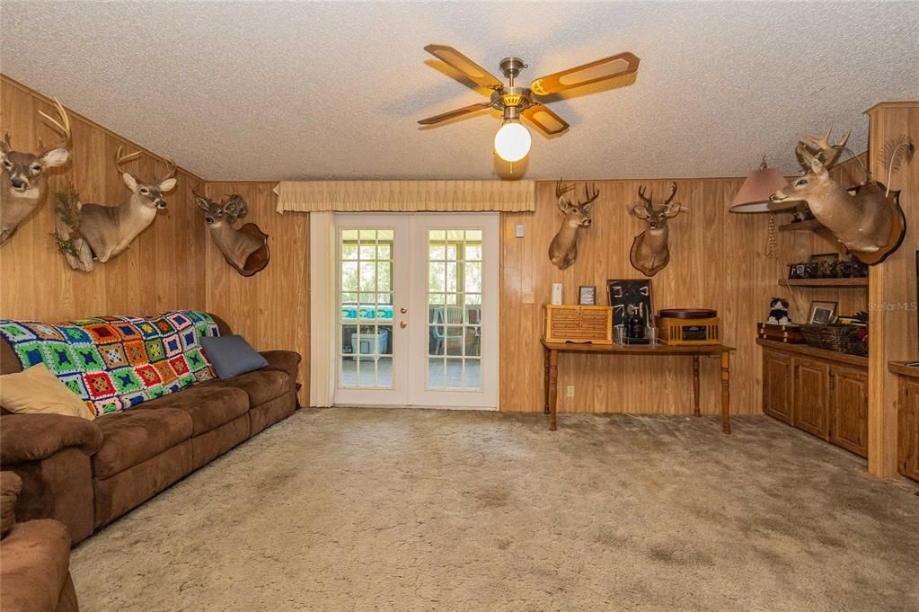 Family room with French doors out to the screened patio.