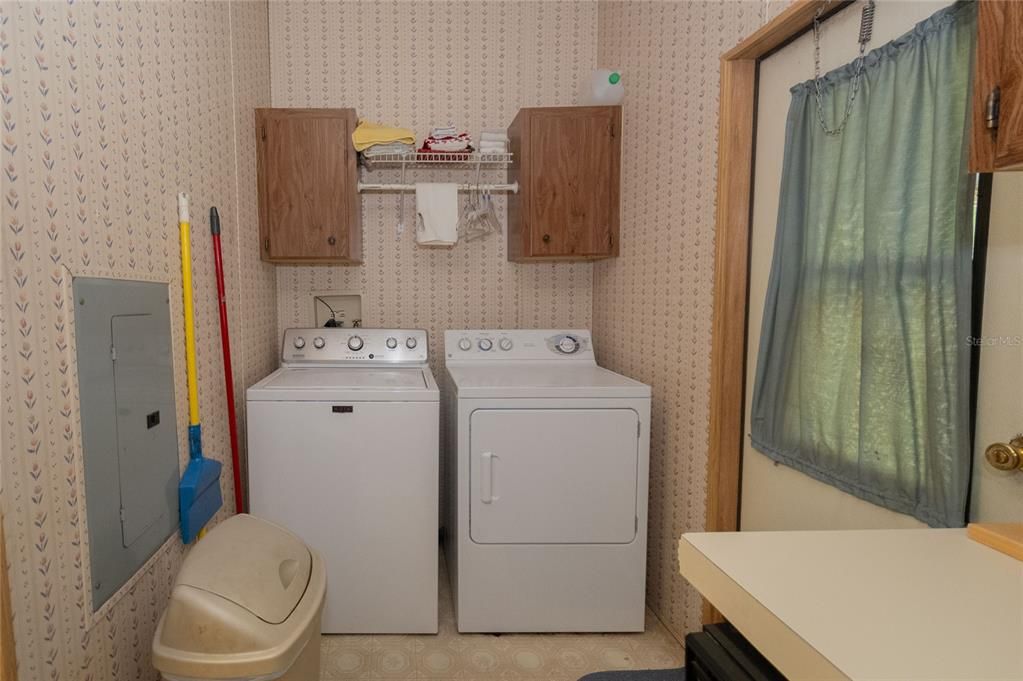 Laundry area with access to the side covered patio.