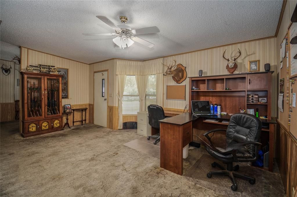 Living room being used as an office.