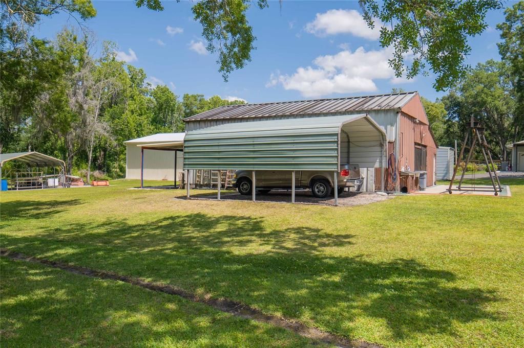 Side view of Barn/workshop and 1 of the carports.