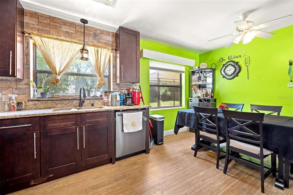 Kitchen has stainless steel appliances and granite countertops.