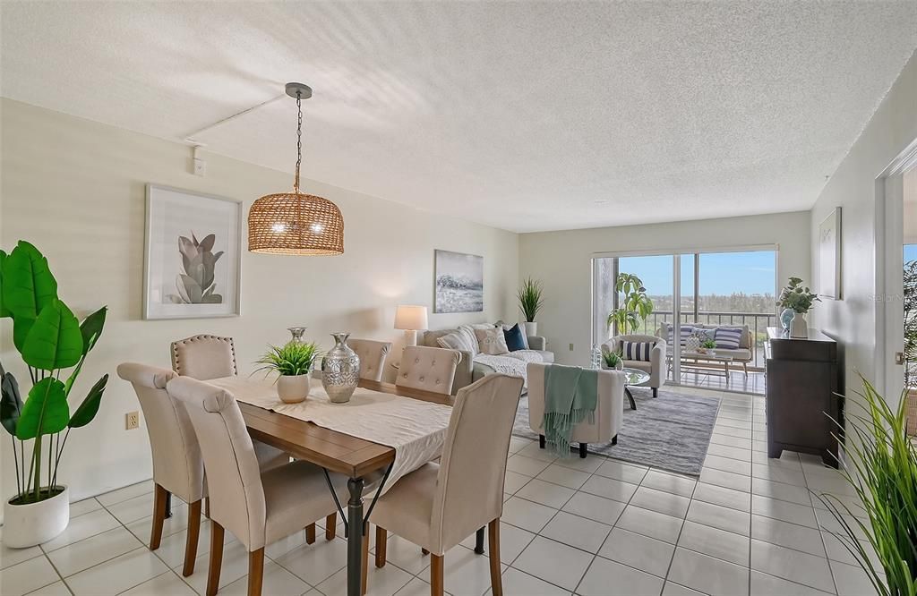 Dining and living areas overlooking the lanai and Little Sarasota Bay and Nature Preserve