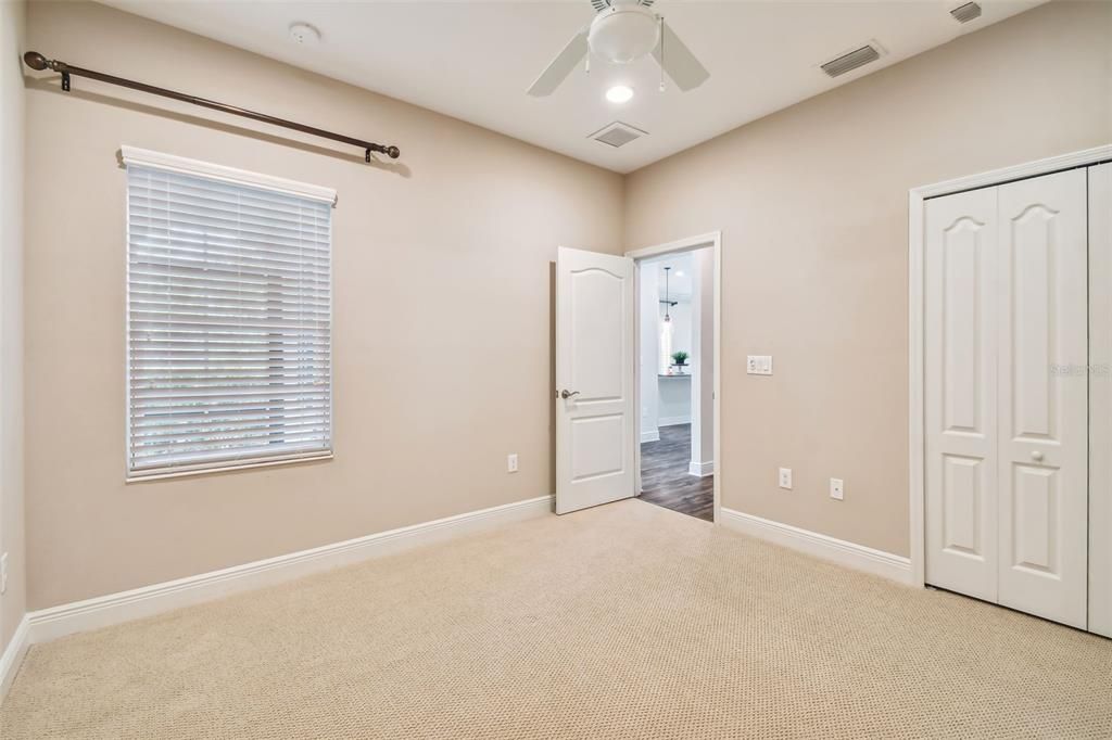 Second bedroom. Spacious reach-in closet. Plush stain-resistant carpet. 5 1/4 colonial baseboards throughout.