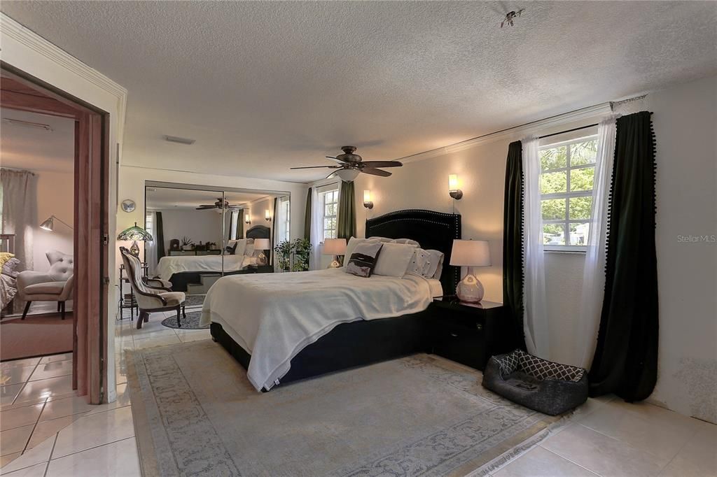 Large master bedroom with custom organized closet.