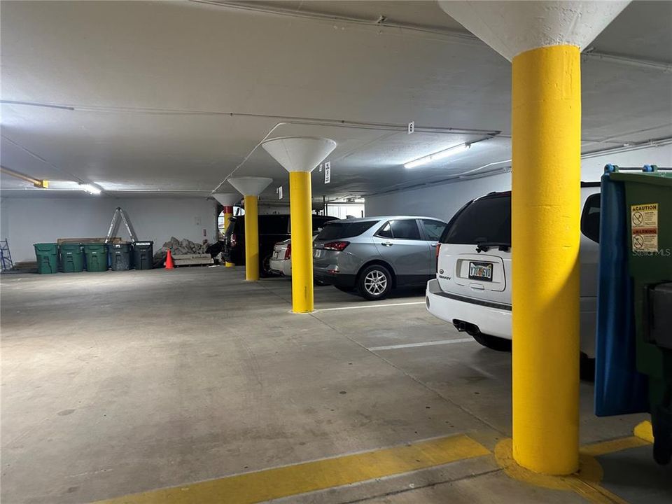 Inside Garage - Parking space is close to entrance to bldg - Black Suv is in the parking spot #2