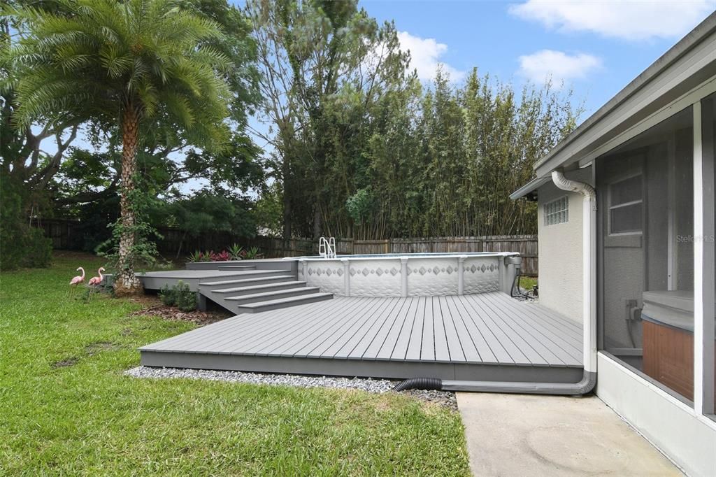 Above ground pool is surrounded by a Trex composite deck!