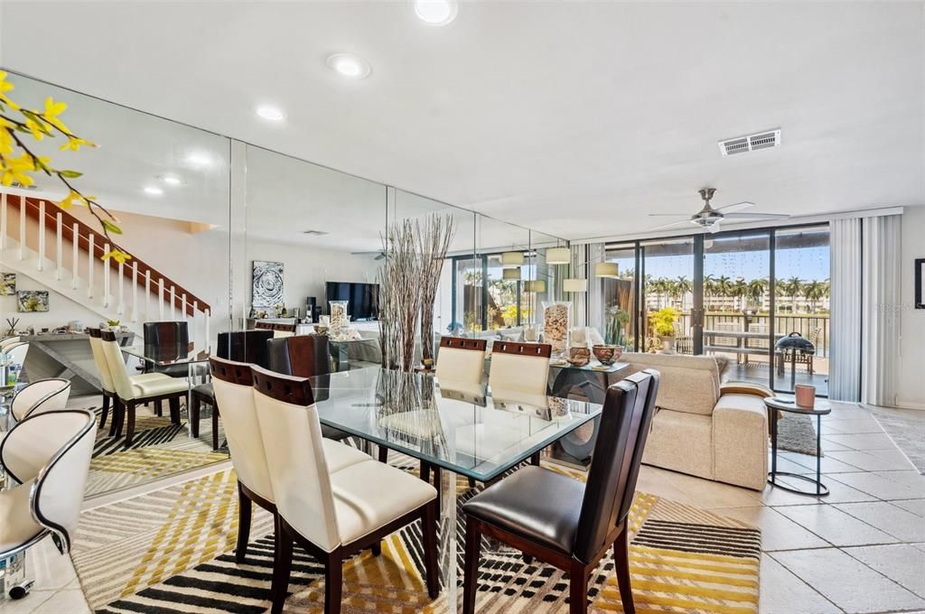 Dining to living to patio, mirrors even reflecting the stairs !