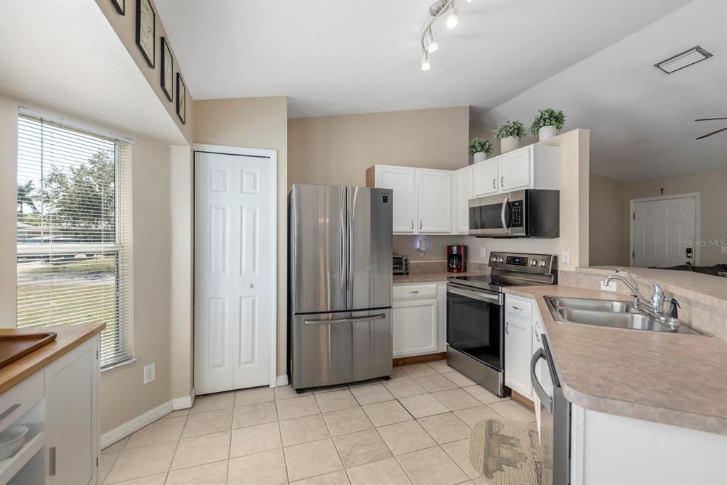New stainless steel appliances and pantry for extra storage