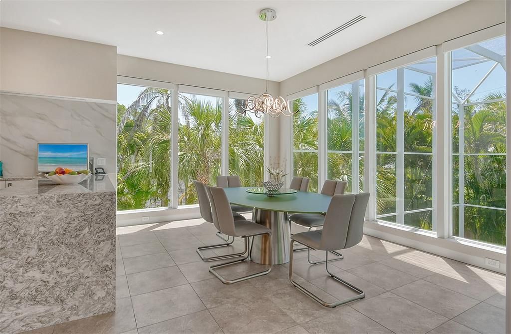 Dining Area with floor to ceiling windows which are electronically operated.