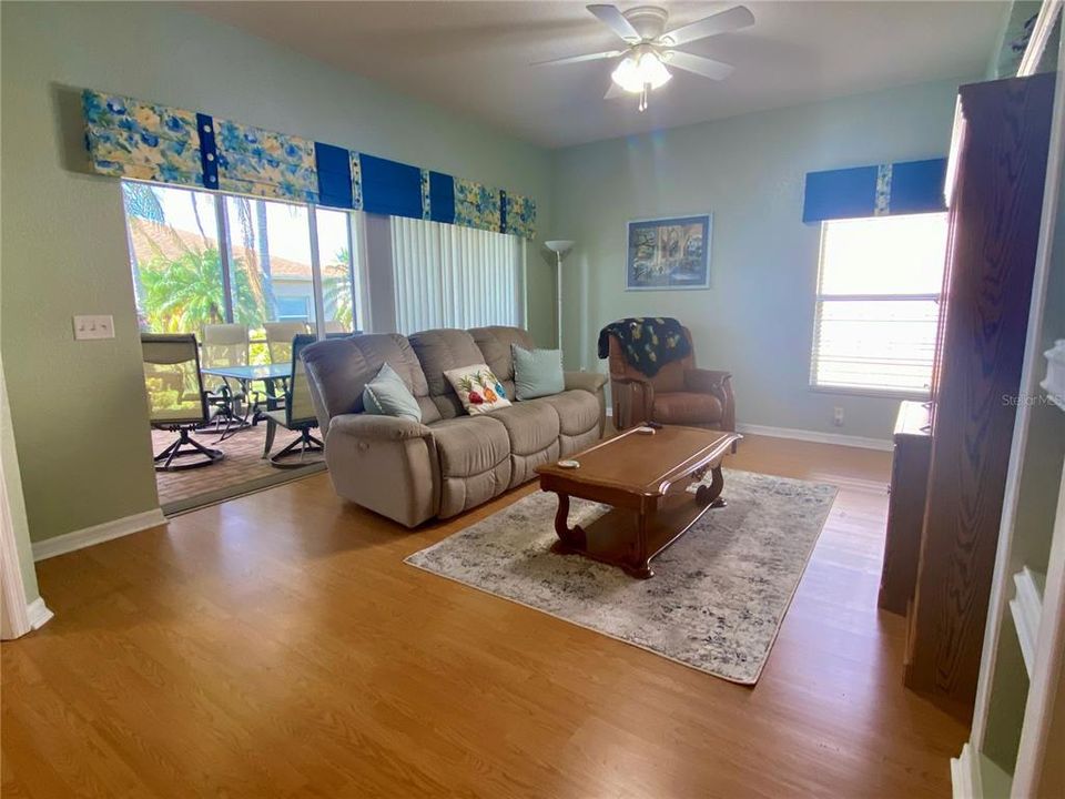 Living room with triple sliders to lanai