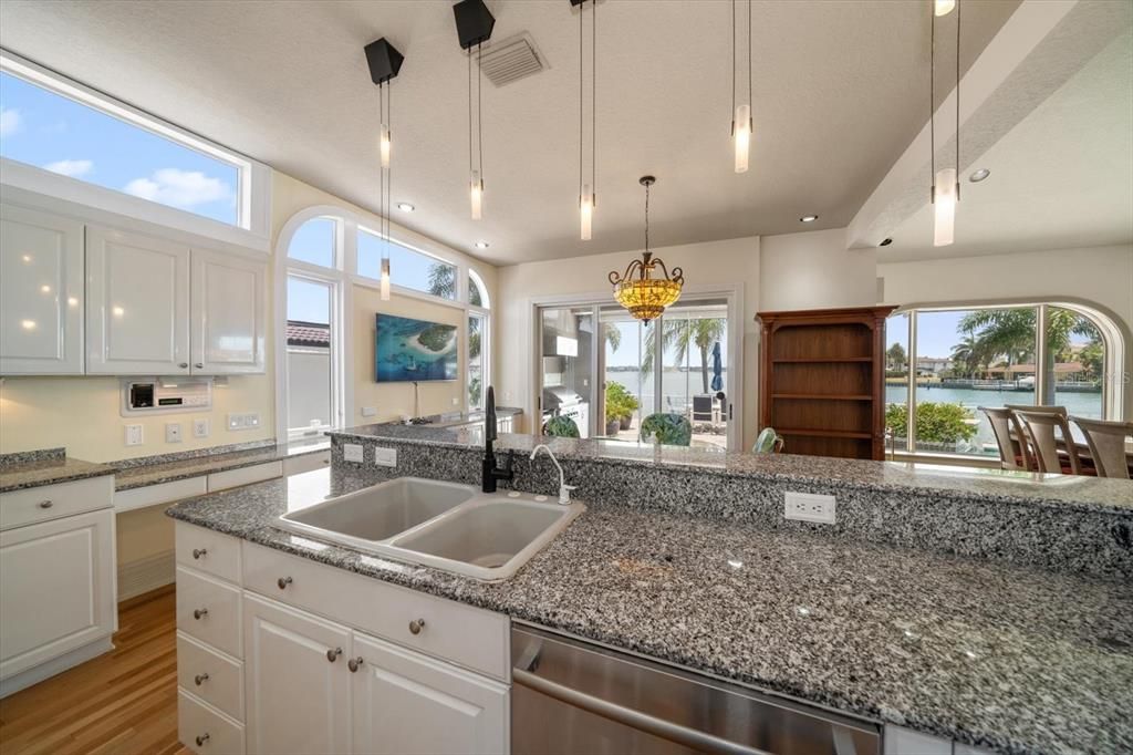 Kitchen is light and bright with water views.