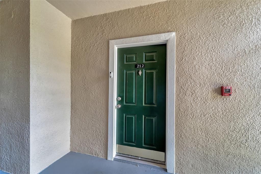 To the left of the front door is a conveniently located locked closet- perfect for storing beach chairs without needing to bring them through the residence