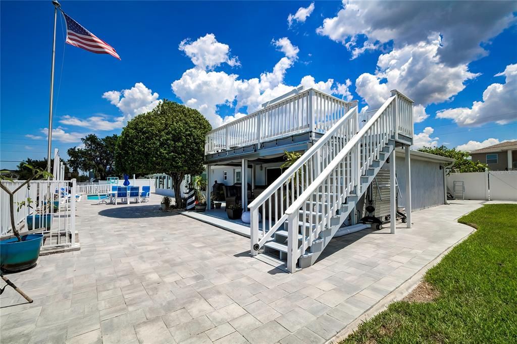 Expansive Brick Paver Patio, Covered Deck with Observation Deck Above.