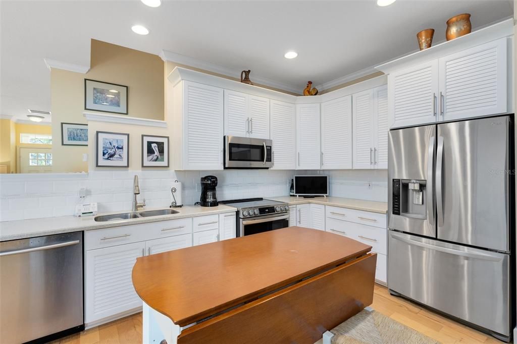 Beautifully renovated kitchen complete with 42" solid wood cabinets, stainless steel appliances and an expandable kitchen island.