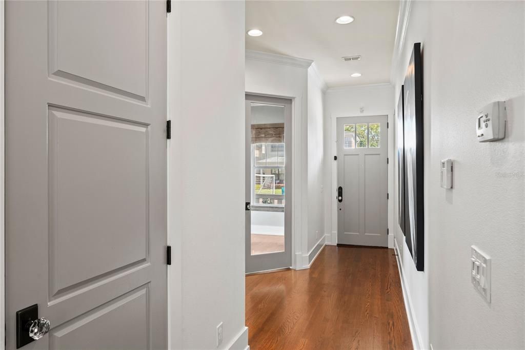 High ceilings, lots of natural light, brown molding and beautiful wood floors!