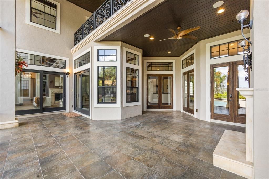 Covered lanai off main living areas, beautiful balcony above & wood inlaid ceiling