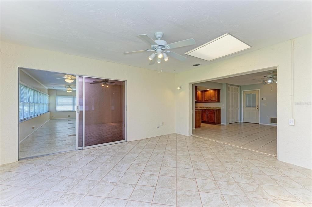 Enclosed porch under air, skylight, with views into family room and kitchen, and enclosed lanai.