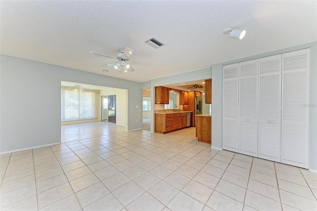 Family room, kitchen, dry bar/pantry, enclosed patio.