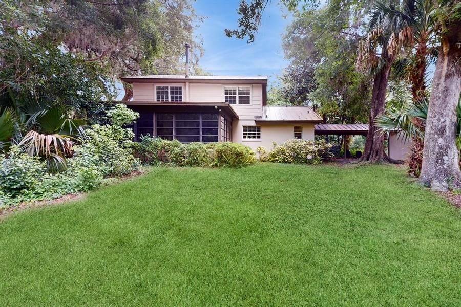 REAR ELEVATION WITH LUSH LANDSCAPING