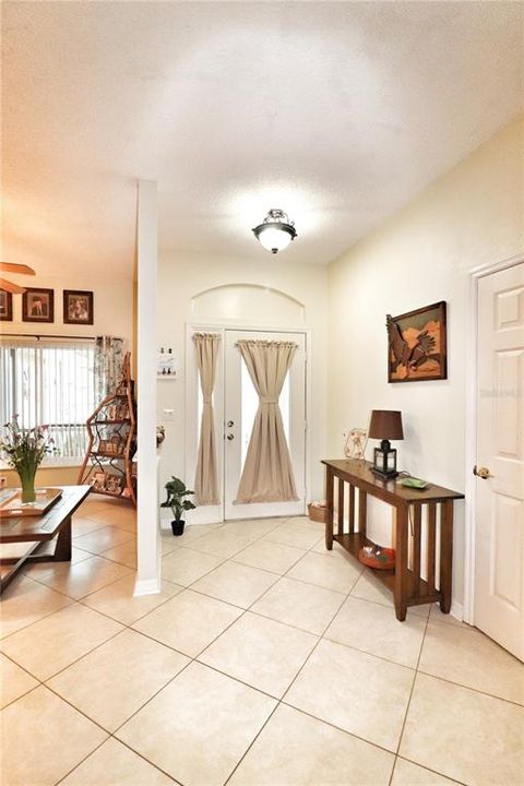entry foyer with a coat closet
