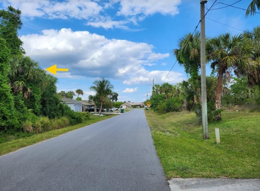 Looking down Lomond Drive. Arrow points ti lot