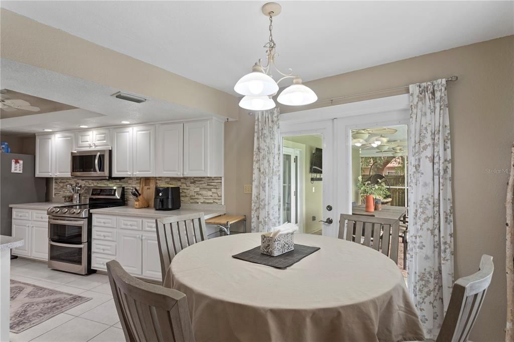 Eat-in dinette area convenient to the kitchen and pool deck.
