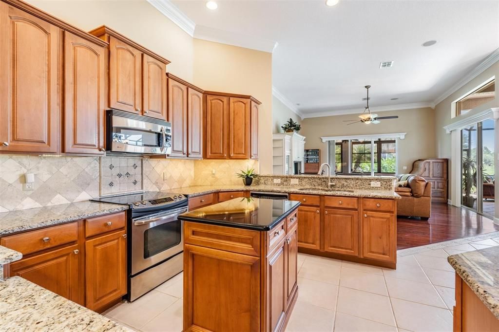 Kitchen with island opens to family room