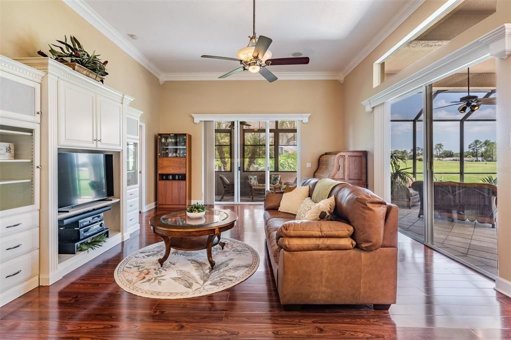 Open and airy family room with golf course and laini views