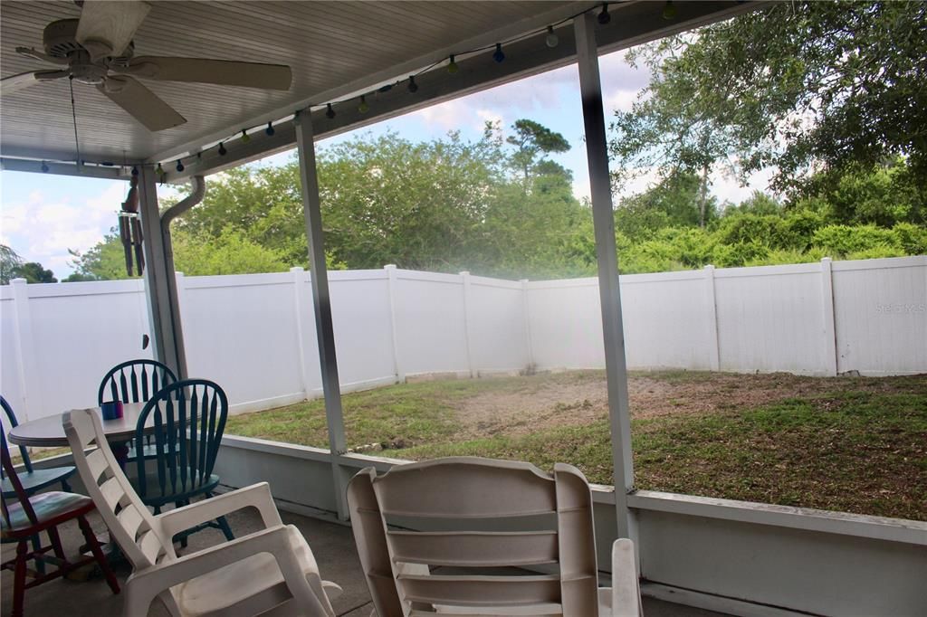 Back yard is full enclosed with new white vinyl fencing.