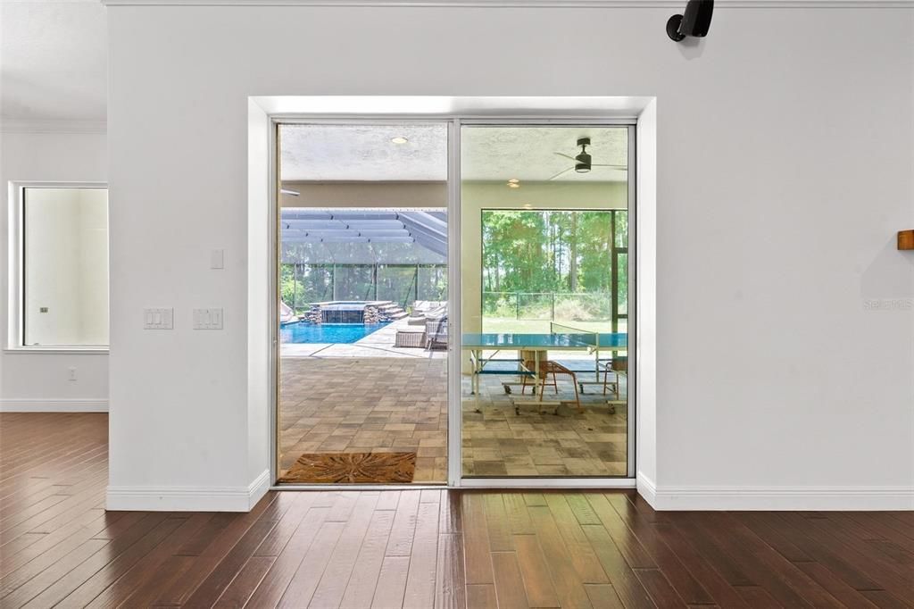 Family Room with Sliding Doors leading to Lanai and Pool Area