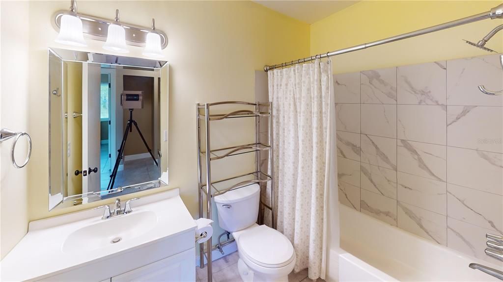 Full Hall Bathroom with Tiled Tub/Shower combo