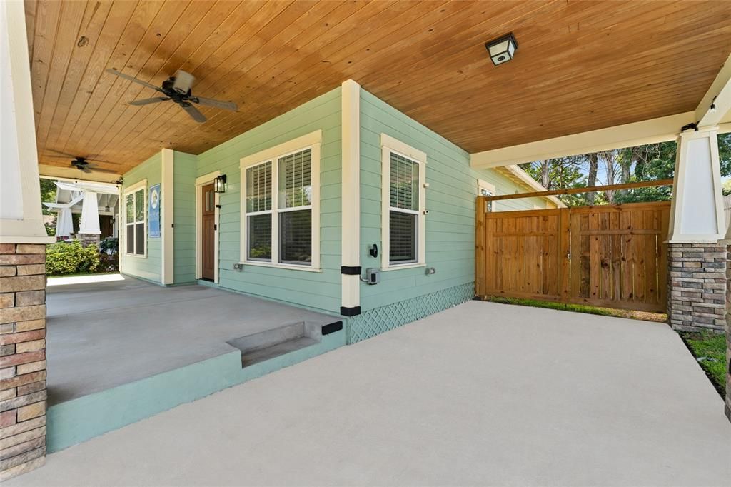 Wood panelled ceilings, electric port for your car, and a gorgeous custom wooden double gated entry to the back yard.
