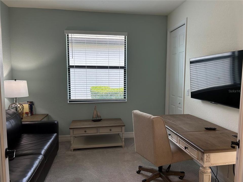 Den/office with desk and pull out couch