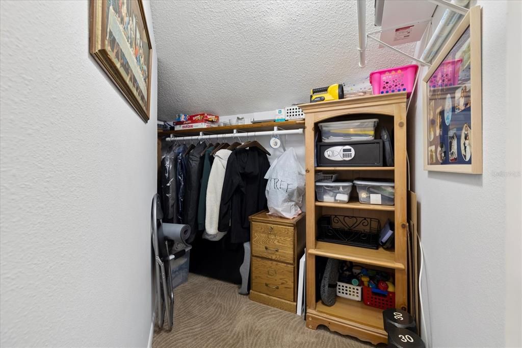 Wrap around walk-in closet offers plenty of storage