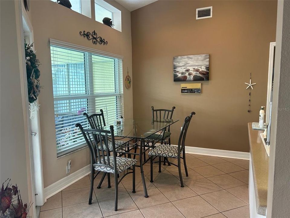 Breakfast area offers pool access from kitchen area
