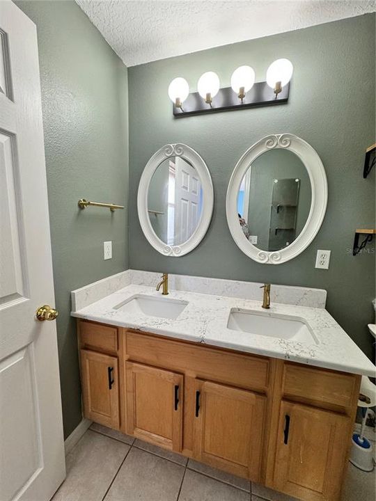 PRIMARY BATHROOM WITH DOUBLE VANITY AND STAND UP SHOWER