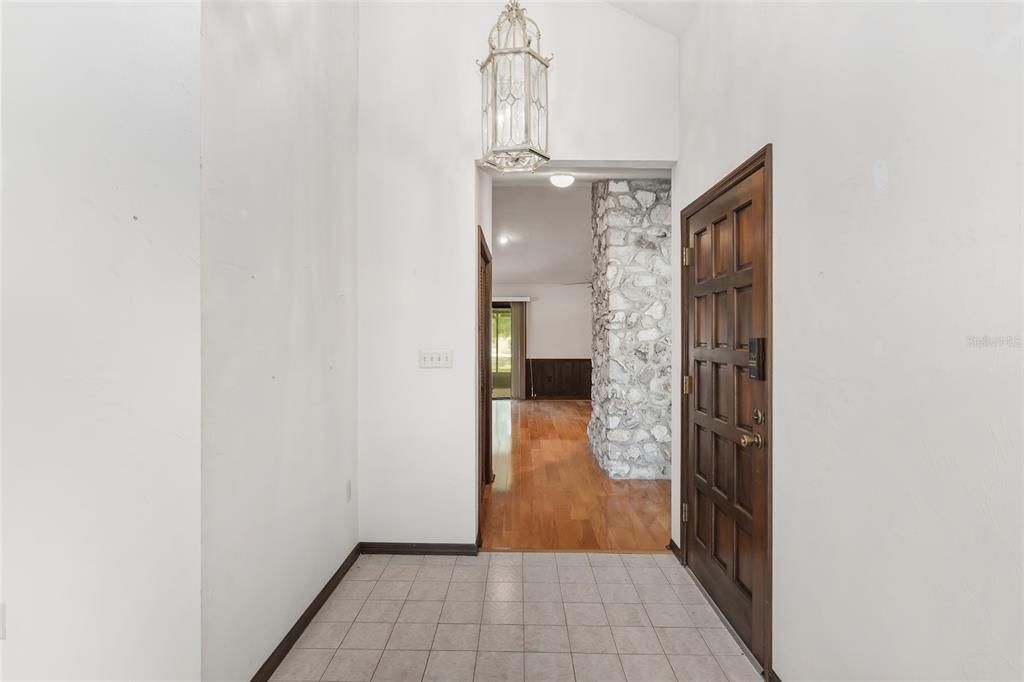 FOYER LOOKING INTO FAMILY ROOM