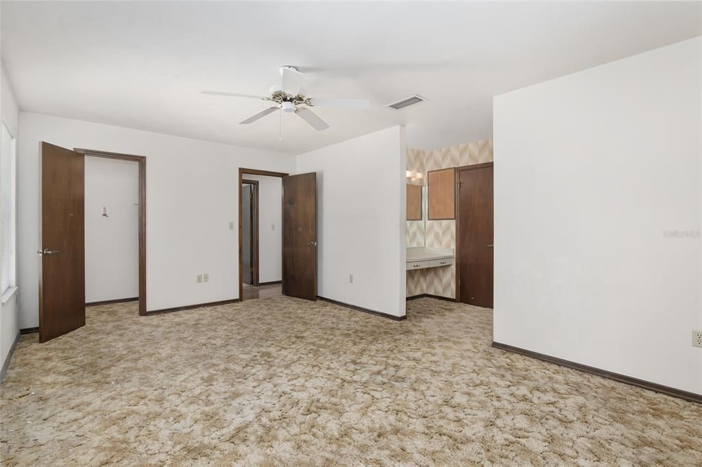 ONE OF TWO WALK-IN CLOSETS IN OWNER'S SUITE