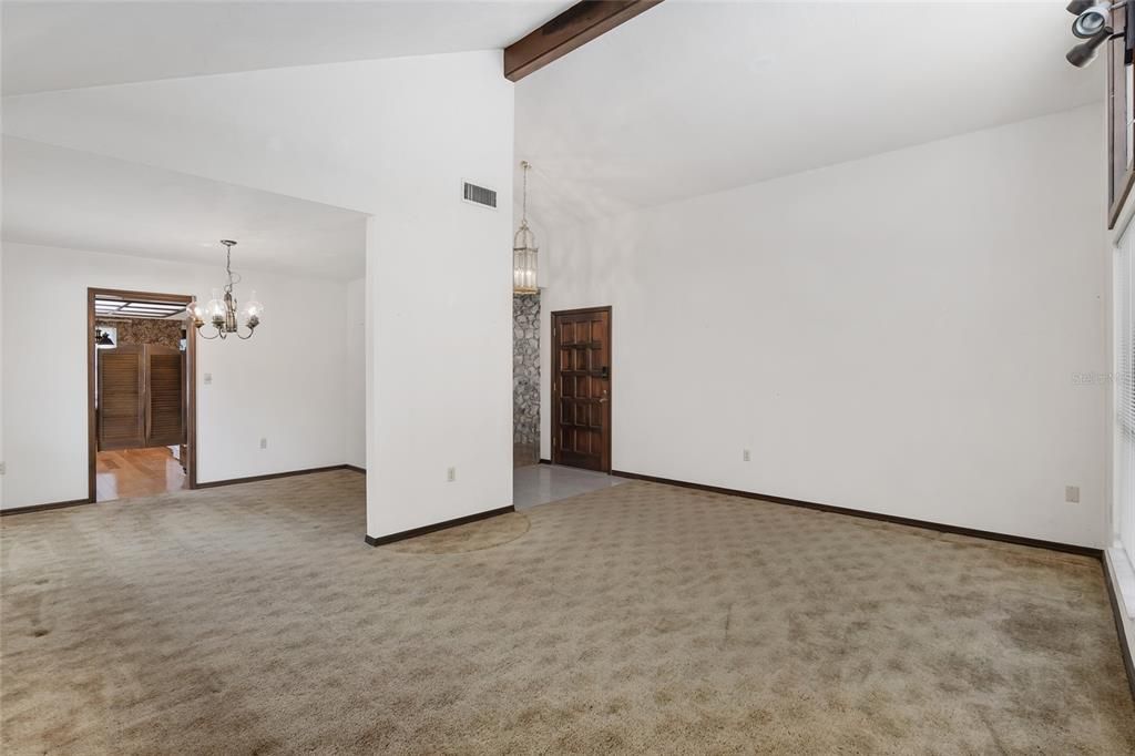 FORMAL LIVING ROOM LOOKING INTO FORMAL DINING ROOM