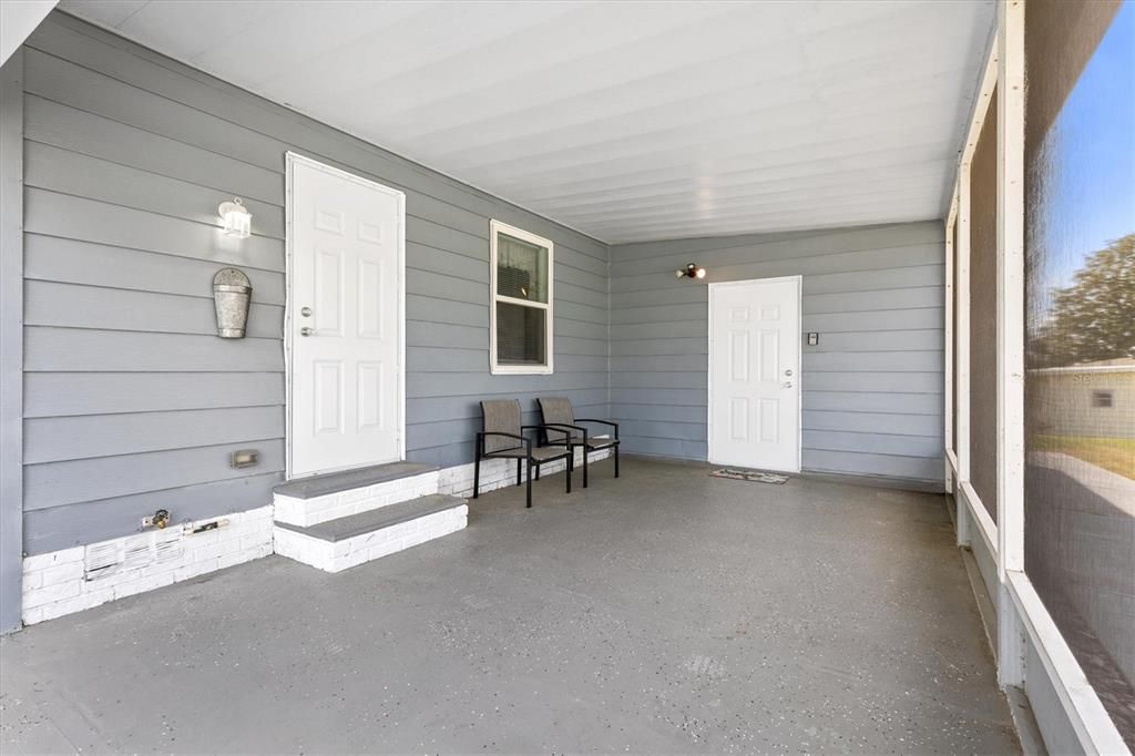 Carport Offers Dry Entrance to Home and Laundry Shed