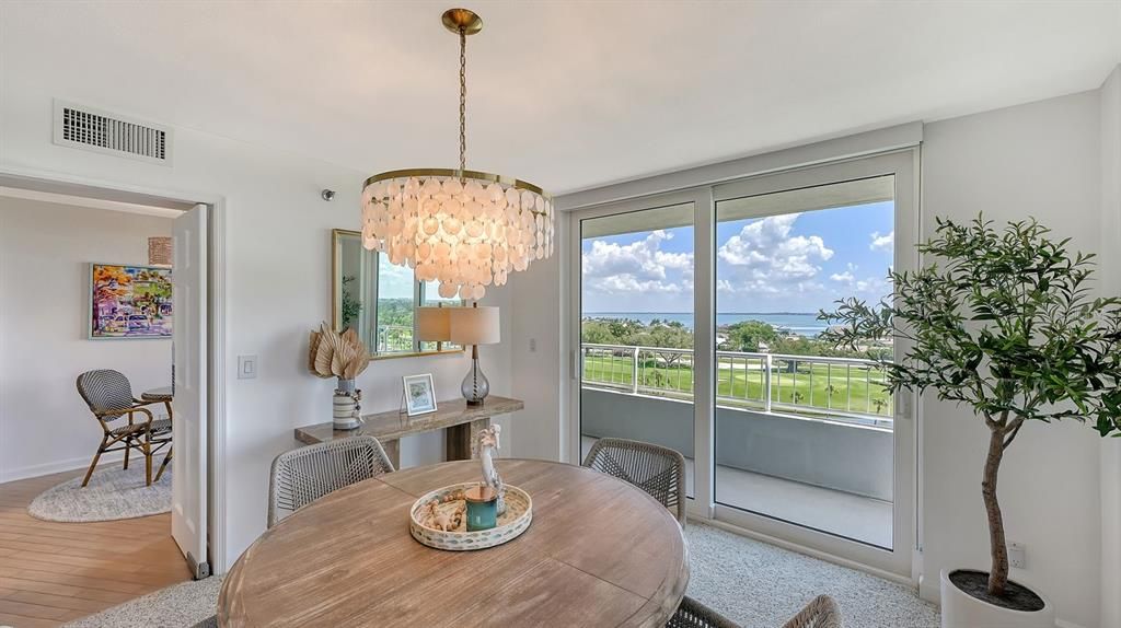 Dining room looking toward kitchen (with convenient swinging door) - Sarasota Bay and golf course views.