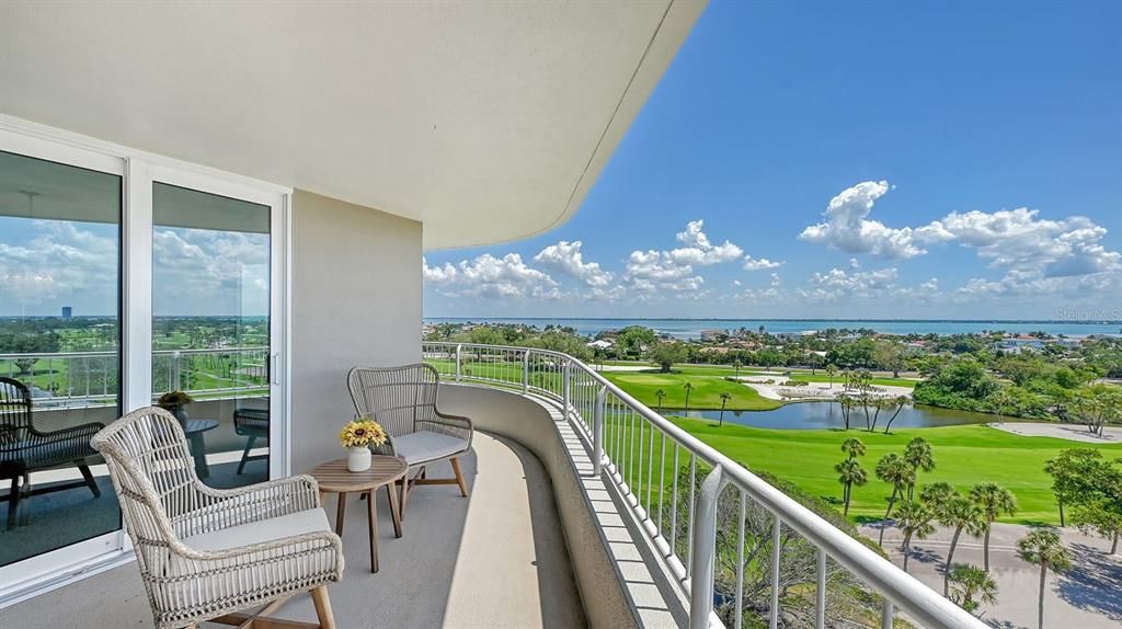 Wraparound balcony looking out over the golf course and Sarasota Bay.